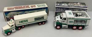 lot 214 image: Vintage HESS Gasolene Collectible Miniature Semi Trailer With Porshe & Truck With Front End Loader (NIB)