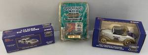 lot 215 image: Vintage Misc. Racing Champions Brickyard 400 Miniature Die-Cast Banks Including # 94 Limited Edition Stock Car, 1937 Chevrolet Roadster & More (NIB)