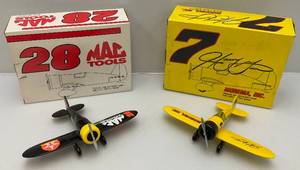 lot 225 image: Vintage Miniature NASCAR Die-Cast Airplane Banks Including Number 7 & 28 (NIB)