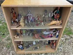 lot 63 image: Lot of Dolls with Wood cabinet