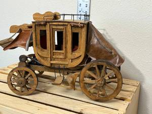lot 43-F2025 image: Handmade wooden stage coach, approximately 14 inches long 9 inches high if I had to guess I would say the 1970s