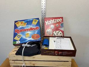 lot 49-F2025 image: Two family board games, Yahtzee with unused score cards, the original Rummikub fast moving tile, rummy game