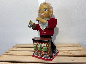 lot 64-F2025 image: Rosko the Bartender is a vintage, battery-operated toy from the 1960s. It is a tin and plastic figure, Not working but very clean