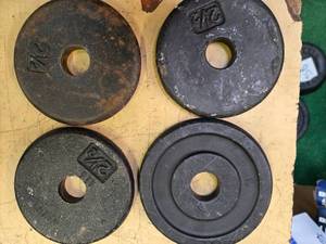 lot 78 image: A lot of Four 2.5LB -One -Inch Weight Plates (USED)