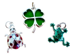 lot 24A image: Sterling Silver Four Leaf Clover and Assorted Charms