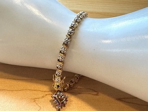 lot 108G image: 7-Inch Gold Tone Sterling Tennis Bracelet with Heart Dangle Charm
