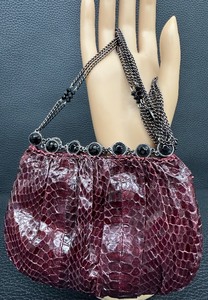 lot 38 image: Clara Kasavina Eel Skin Evening Bag with Chain Strap