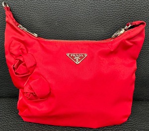 lot 52 image: Vintage Prada Red Nylon Handbag with Floral Accents