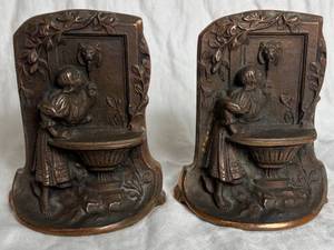 lot 38 image: Antique Pair of Solid Bronze Bookends Girl Drinking from Lion Fountain