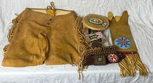 lot 56 image: Replica Leather and Beaded Collection - Leather Pants with Fringe, Leather Beaded Belt with Pawnee Knife & Holder, and Beaded Bag Pouch