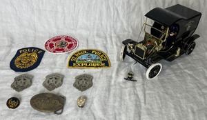 lot 92 image: Police Collection - St Paul Police Patches, Belt Buckle, Vintage St Paul School Police Badges,  Pins and Gearbox Replica 116 Scale 1912 Ford Model T NYPD Truck #4987 OF 5000