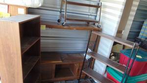 lot 10 image: Entertainment Center, Wood Shelf, Small Shelf on Wheels and Metal Shelf