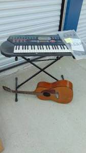 lot 17 image: Casio Keyboard No Cord and Guitar
