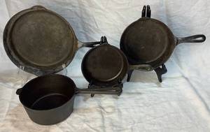 lot 31 image: Cast Iron Skillets including Griswold 8 and Sauce Pan