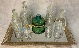 lot 35 image: Vintage Gold Mirror with Glass Bottle Collection