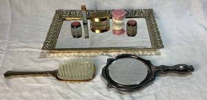 lot 34 image: Vintage Vanity Mirror with Brush, Hand Mirror and Lipstick Holder, Cutex Containers and Lidded Glass Jar