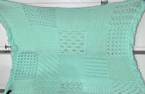 lot 61 image: Handcrafted Mint Knit Multi Stitch 48 x 62 Throw