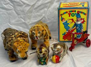lot 85 image: Vintage Wind Up Toys - Blic Clown Riding Scooter Toy, US Zone Germany Metal and Two Marx Leopard & Tiger