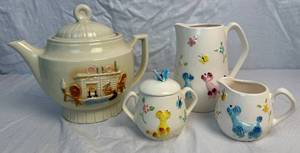 lot 81 image: Vintage Enesco Poodle & Butterfly Pitcher with Creamer & Sugar and Porcelier Vitreous Teapot Colonial Hearth