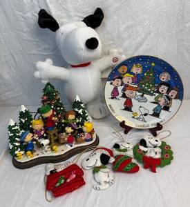 lot 84 image: Peanuts Collection - Christmas Time Is Here Light Up Collectible, Merry Christmas Charlie Brown Plate, Dancing Snoopy and 1958 Snoopy Ornaments