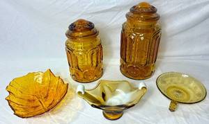 lot 59 image: Vintage Amber Glass Collection - LE Smith Canisters, MCM Cabbage Leaf Bowl, Amber & White Glass Dish and Amber Etched Glass Dish with Handle