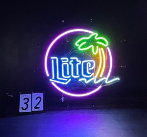 lot 32 image: Miller Lite tropical neon sign with palm tree