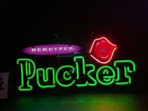 lot 44 image: DeKuyper Pucker sweet and sour mixer with puckered lips, neon sign