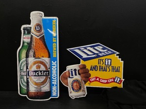 lot 131 image: Heineken Buckler NA and Miller Lite tin tackers, Lot of 2, NOS