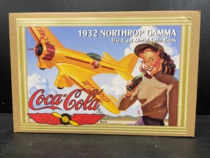 lot 159 image: Ertl 1932 Northrop Gamma airplane, die cast metal coin bank, Coca-Cola, NIB