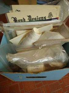 lot 42 image: Box of Crosstitch Patterns, Kits, Christmas Patterns, & Aida Cloth