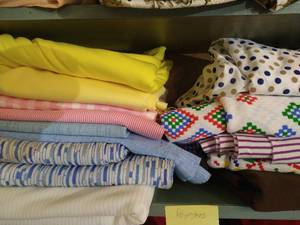 lot 156 image: Shelf of Large Cuts Polyester Fabrics