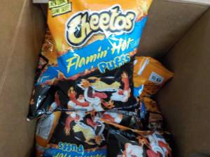 lot 87 image: Case of Cheetos Flamin Hot Puffs 2 ...