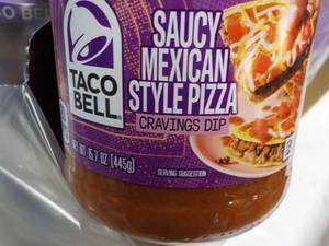 lot 145 image: 12 jars Taco Bell Saucy Mexicana St...