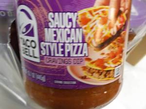 lot 146 image: 12 jars Taco Bell Saucy Mexicana St...