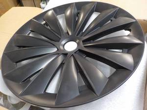 lot 248 image: 4 pcs Model Y Plastic Wheel Hubcaps...