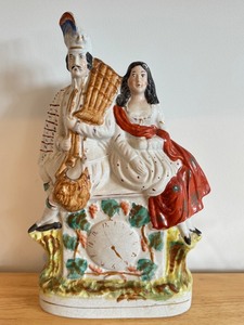 lot 7D image: Vintage 15-Inch Staffordshire-Style Pottery Figurine with Highland Couple and Clock Face