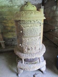 lot 7 image: Antique Round Oak Stove...