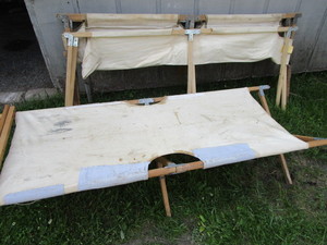 lot 45 image: Camp cots, three folding...