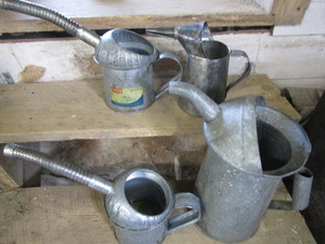 lot 235 image: Vintage oil & water cans...