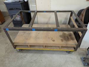 lot 69 image: 60 L x 34.5 W x 32 H - Solid Steel Welding Table with Bottom Storage - On Heavy Duty Casters