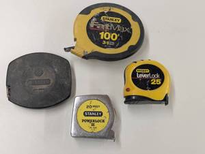lot 28 image: Set of 4 Stanley Tape Measures - 2-100ft, 1-25ft, 1-20ft