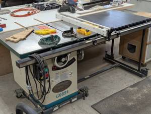 lot 170 image: Grizzly Industrial G0691 10 inch 3HP 220V Cabinet Table Saw with Long Rails & Riving Knife - Upgraded Moving Cart and Rip Bar