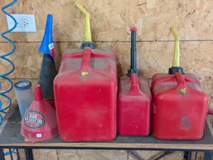 lot 287 image: Gas Lot - 3 Cans and Pile of Funnels