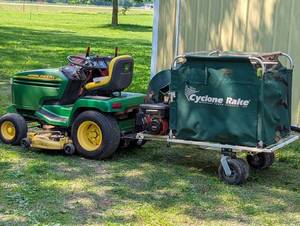 John Deere 325 with Woodland Power Cyclone Rack and Large Mower Deck