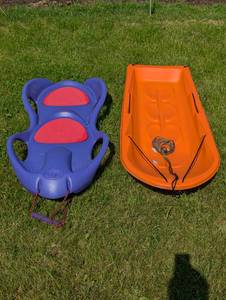 lot 335 image: 2 Heavy Duty Kids Sleds - Orange One is Super Long