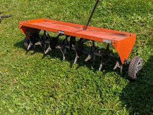 lot 332 image: Agri-Fab 48 in. Orange Plug Aerator
