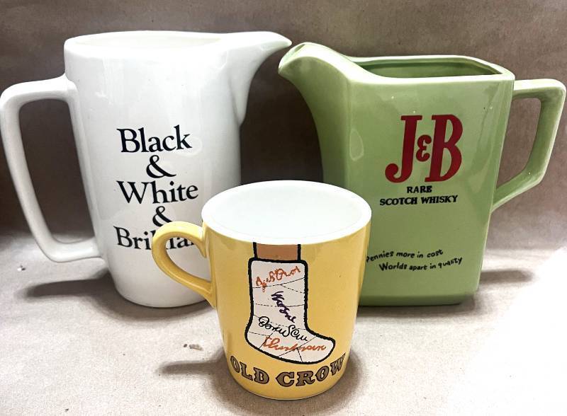 lot 80 image: Vintage Black and White Whiskey and J& Whisky Pitchers and Old Crow Cup