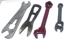 lot 83 image: Antique Planet Jr. Wrench, Hackett No 5 Multi Tool, Brinks Multi Wrench and Small Wrench