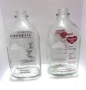 lot 99 image: Two Vintage Milk Bottles Oberweis and Lamers Dairy