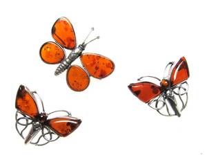 lot 44 image: Very Nice Group of Sterling Silver & Amber Butterfly PinsBrooches